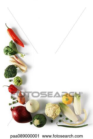 Stock Image - Various vegetables laid out in L shape, high angle view. Fotosearch