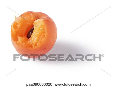 Stock Image - Apricot with bite missing, close-up. Fotosearch