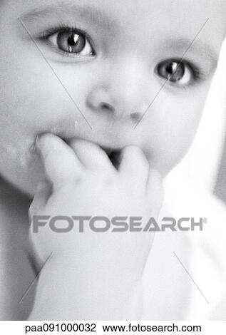 Baby with fingers in mouth, close-up, b&w View Large Photo Image Stock Image - Baby with fingers in mouth, close-up, b&w. Fotosearch