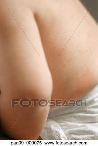 Stock Photography - Baby's arm and back, close-up. Fotosearch