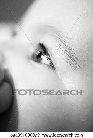Stock Photo - Baby's eye, close-up, b&w. Fotosearch