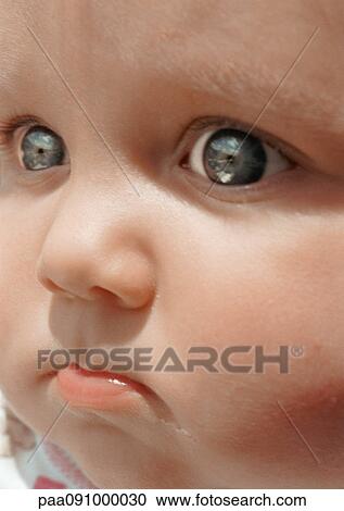Stock Image - Baby's face, close-up. Fotosearch