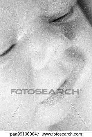 Stock Photo - Baby's face, extreme close-up, b&w. Fotosearch