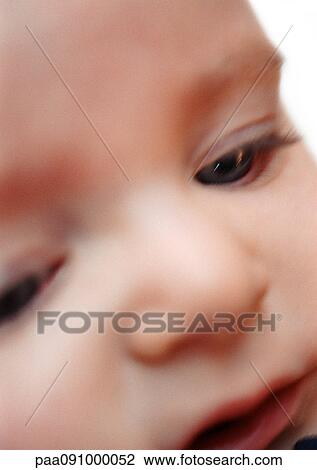 Stock Image - Baby's face, extreme close-up. Fotosearch