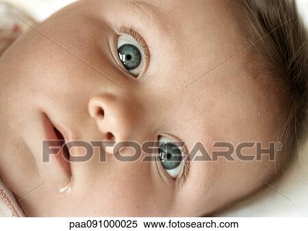 Stock Photography - Baby's face, looking at camera, close-up. Fotosearch