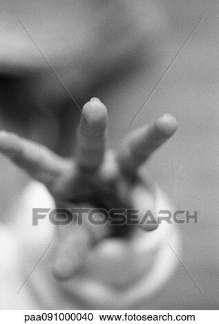 Stock Image - Baby's fingers reaching, close-up, b&w. Fotosearch