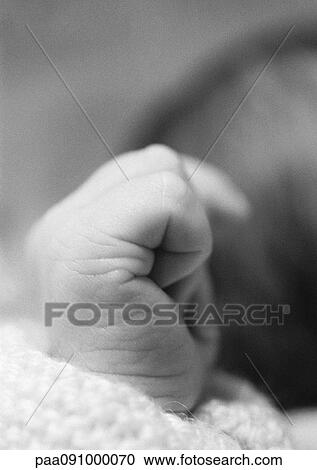 Stock Image - Baby's fist, close-up. Fotosearch
