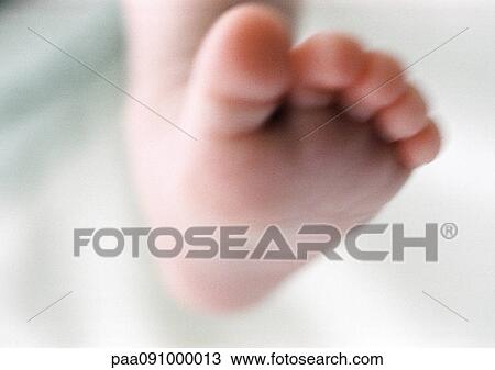 Stock Image - Baby's foot, close-up. Fotosearch