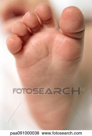 Stock Photo - Baby's foot, close-up. Fotosearch