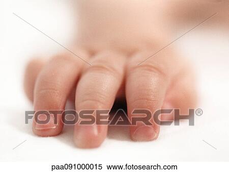 Stock Photography - Baby's hand, close-up. Fotosearch