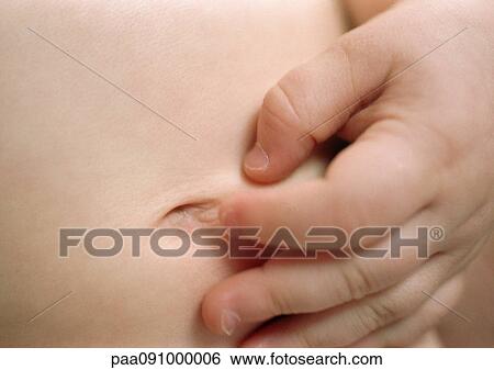 Child's hand on baby's belly, close-up View Large Photo Image Stock Photograph - Child's hand on baby's belly, close-up. Fotosearch