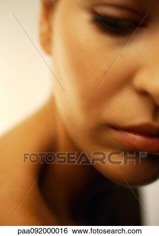 Woman's face looking down, close-up, partial view, blurred View Large Photo Image Stock Photograph - Woman's face looking down, close-up, partial view, blurred. Fotosearch