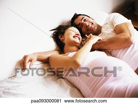 Man and pregnant woman side by side on bed View Large Photo Image Stock Image - Man and pregnant woman side by side on bed. Fotosearch