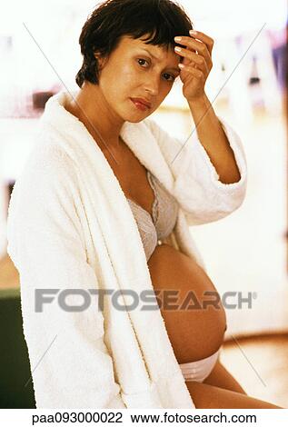 Pregnant woman in open bathrobe, portrait View Large Photo Image Stock Image - Pregnant woman in open bathrobe, portrait. Fotosearch