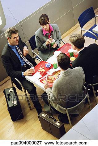 Business people having lunch on trays, elevated view View Large Photo Image Stock Photo - Business people having lunch on trays, elevated view. Fotosearch
