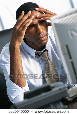 Businessman holding head in hands View Large Photo Image Picture - Businessman holding head in hands. Fotosearch