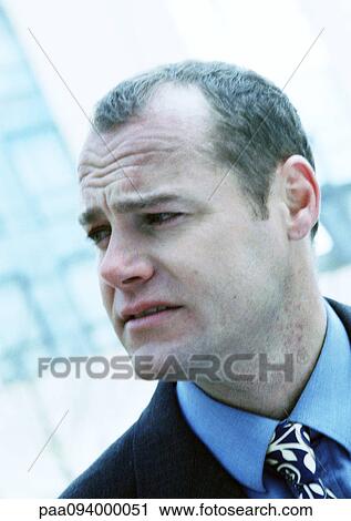 Stock Image - Businessman's face, close-up. Fotosearch
