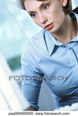 Businesswoman looking attentive, close-up View Large Photo Image Stock Photography - Businesswoman looking attentive, close-up. Fotosearch