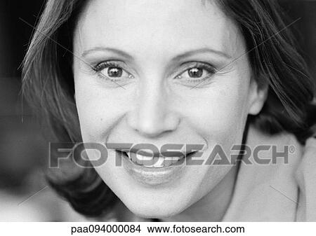 Businesswoman smiling at camera, close-up, portrait, B&W View Large Photo Image Picture - Businesswoman smiling at camera, close-up, portrait, B&W. Fotosearch