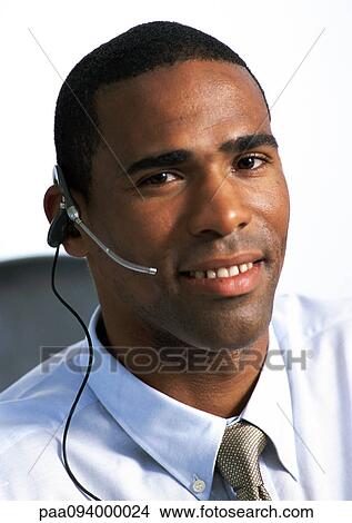 Man wearing headset, close-up, portrait View Large Photo Image Picture - Man wearing headset, close-up, portrait. Fotosearch