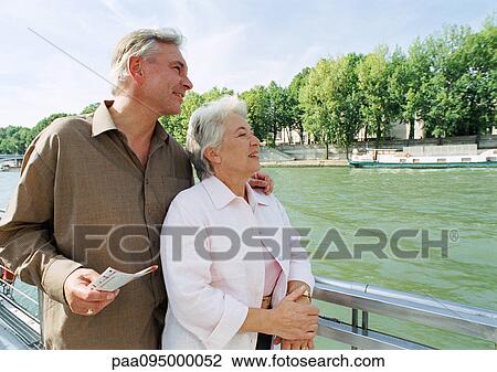 France, Paris, mature man and woman on a boat in the River Seine View Large Photo Image Stock Image - France, Paris, mature man and woman on a boat in the River Seine. Fotosearch