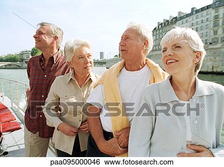 France, Paris, mature men and women on a boat in the River Seine View Large Photo Image Stock Photograph - France, Paris, mature men and women on a boat in the River Seine. Fotosearch