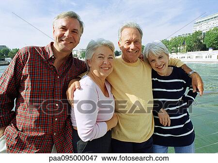 France, Paris, mature men and women standing in front of the River Seine View Large Photo Image Stock Photo - France, Paris, mature men and women standing in front of the River Seine. Fotosearch