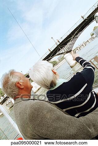 France, Paris, mature woman and man looking at the Pont des Arts View Large Photo Image Stock Image - France, Paris, mature woman and man looking at the Pont des Arts. Fotosearch