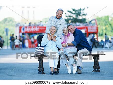 Stock Photo - Group of mature people on a bench, portrait. Fotosearch