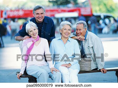 Stock Photo - Group of mature people on a bench, portrait. Fotosearch