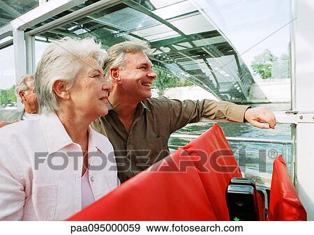 Stock Photo - Mature man and woman on a boat. Fotosearch
