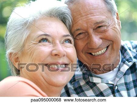 Mature man and woman smiling, close-up, portrait View Large Photo Image Stock Photo - Mature man and woman smiling, close-up, portrait. Fotosearch