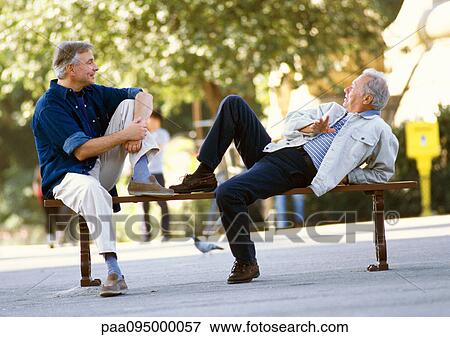 Mature men sitting on a bench View Large Photo Image Stock Photo - Mature men sitting on a bench. Fotosearch