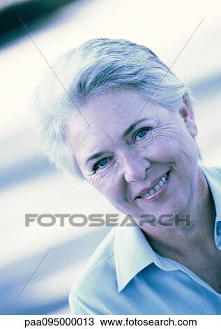 Mature woman smiling, portrait View Large Photo Image Stock Image - Mature woman smiling, portrait. Fotosearch