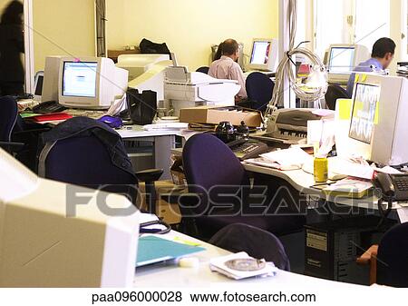 Desks and computers in office, people working in background View Large Photo Image Stock Photo - Desks and computers in office, people working in background. Fotosearch