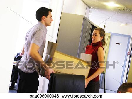 Man and woman carrying box View Large Photo Image Stock Photograph - Man and woman carrying box. Fotosearch