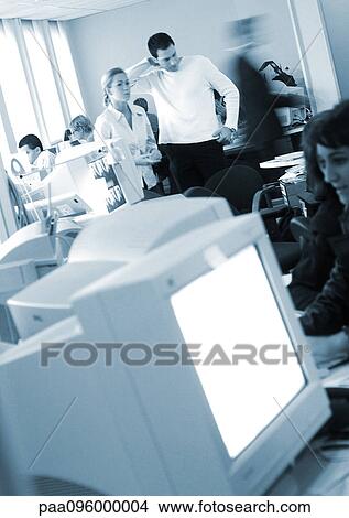 Picture - People in office, blurred. Fotosearch