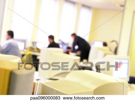 Stock Image - People in office, blurred. Fotosearch