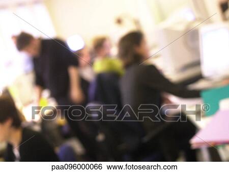 Stock Photograph - People in office, blurred. Fotosearch