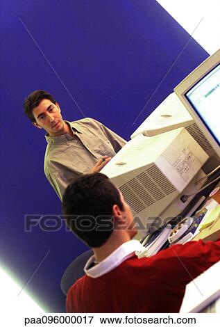 Two men in office View Large Photo Image Stock Photo - Two men in office. Fotosearch