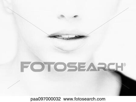 Stock Image - Lower part of woman's face, close-up, B&W. Fotosearch