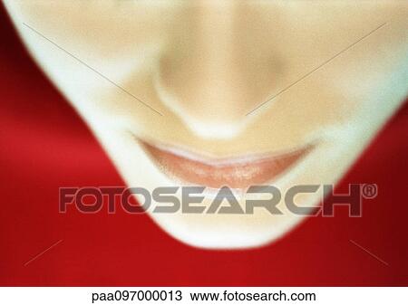 Stock Image - Lower part of woman's face, high angle view, close-up. Fotosearch