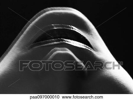 Stock Image - Lower part of woman's face, upside down, close-up, B&W. Fotosearch
