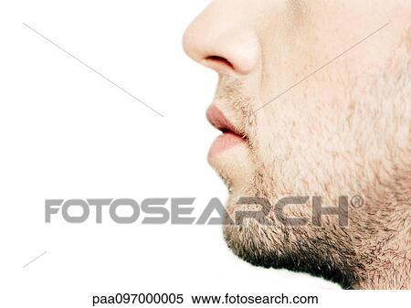 Stock Photography - Man's lower part of face, side view, close-up. Fotosearch