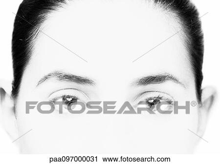 Stock Image - Upper part of woman's face, close-up, B&W. Fotosearch