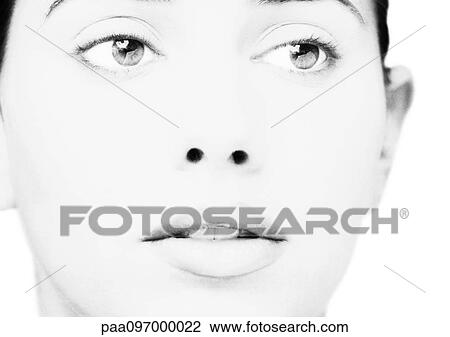 Stock Image - Woman's face, close-up, B&W. Fotosearch