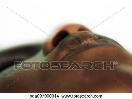 Picture - Woman's face, low angle view, close-up. Fotosearch