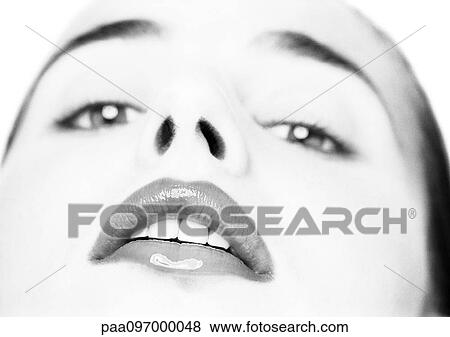 Woman's face, low angle view, looking at camera, close-up, B&W View Large Photo Image Stock Photo - Woman's face, low angle view, looking at camera, close-up, B&W. Fotosearch