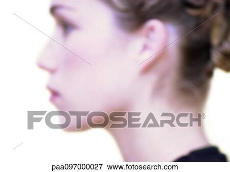 Stock Photo - Woman's face, side view, blurred. Fotosearch