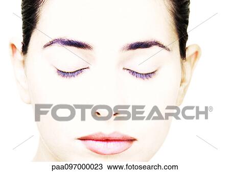 Stock Image - Woman's face with closed eyes, close-up. Fotosearch
